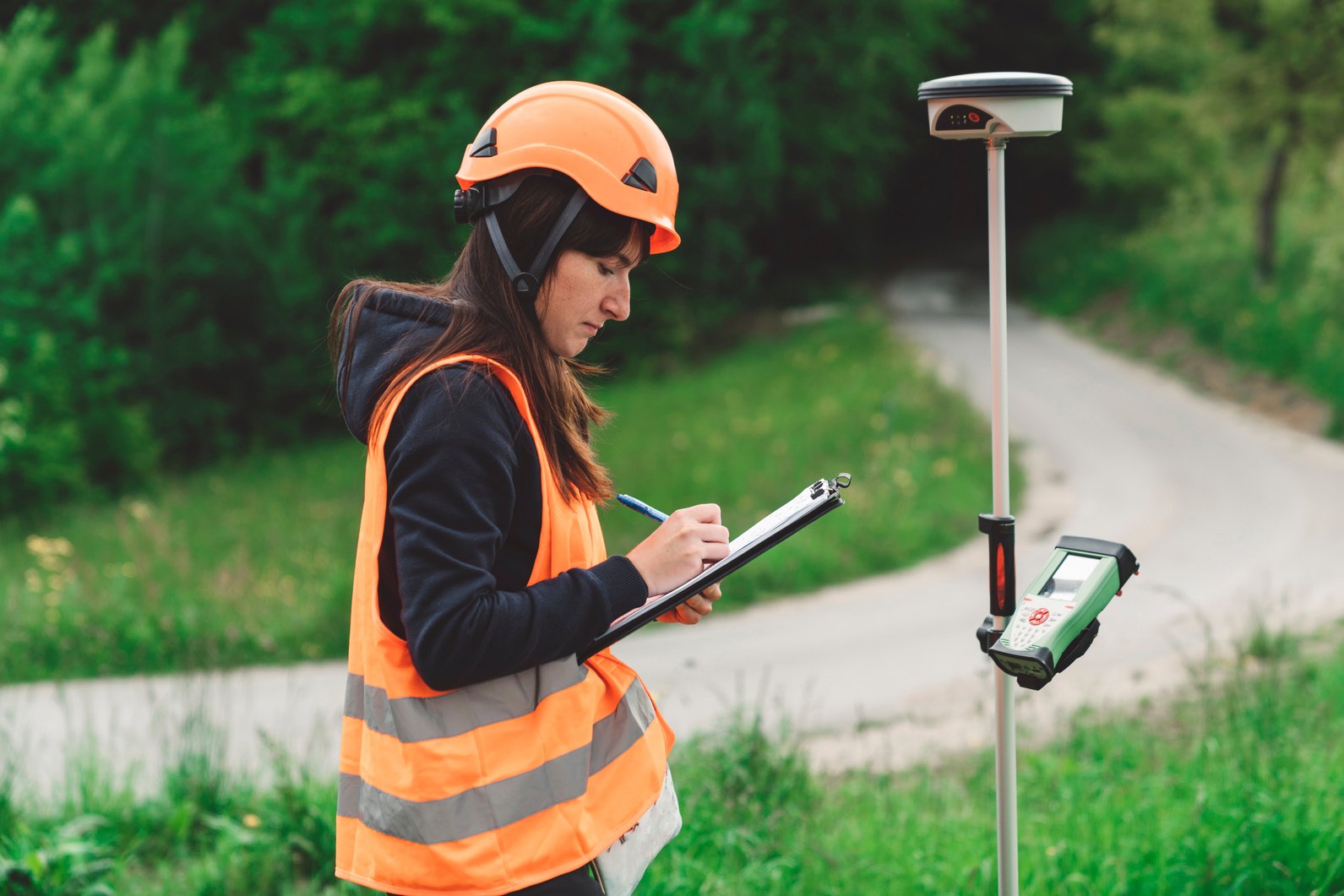 Woman surveyor taking notes